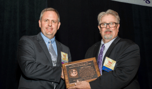 SRK Practice Leader Terry Braun accepting the Industry Partnership Award.